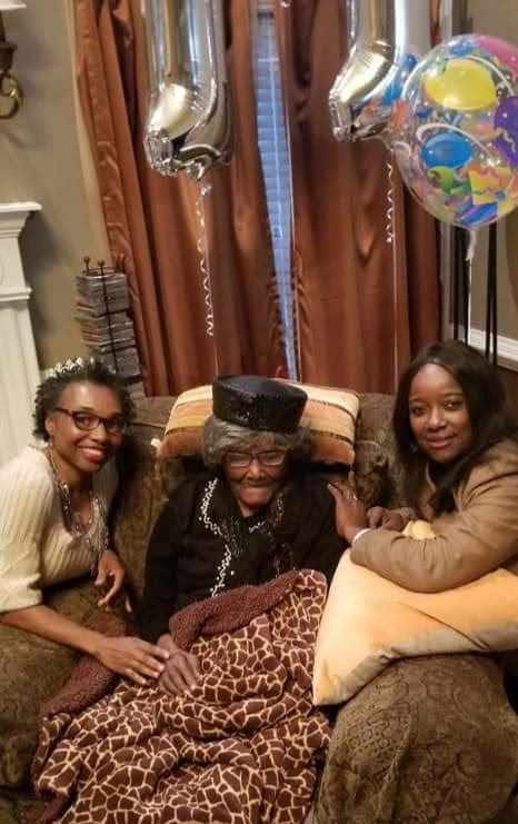 Adopt a Mom and Pop volunteers celebrating a birthday with a senior citizen
